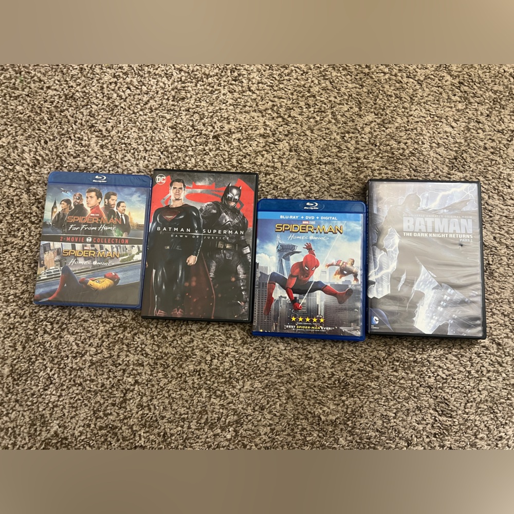 Blu-ray/ dvd movie bundle featuring Batman and Spiderman